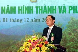 Bộ trưởng Bộ Nông nghiệp và Phát triển nông thôn Nguyễn Xuân Cường đọc diễn văn ôn lại chặng đường 75 năm hình thành phát triển của ngành Lâm nghiệp Việt Nam. (Ảnh: Tá Chuyên/TTXVN)