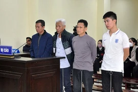 Các bị cáo tại phiên tòa xét xử. (Ảnh: Nguyễn Nam/TTXVN)