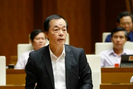 Bộ trưởng Bộ Xây dựng Phạm Hồng Hà trả lời chất vấn của các đại biểu Quốc hội. (Ảnh: Doãn Tấn/TTXVN)