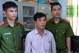 Đối tượng Dương Minh Hiến bị bắt giữ. (Ảnh: Võ Dung/TTXVN)