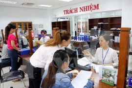 Giờ bắt đầu làm việc tại các cơ quan Nhà nước hiện nay chưa thống nhất. (Ảnh minh họa: TTXVN)