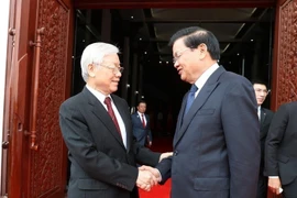 Tổng Bí thư, Chủ tịch nước Nguyễn Phú Trọng hội kiến Thủ tướng Thongloun Sisoulith trong chuyến thăm hữu nghị chính thức Lào (Vientiane, 24/2/2019). (Ảnh: Trí Dũng/TTXVN)