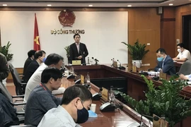 Bộ trưởng Trần Tuấn Anh chủ trì cuộc họp tìm giải pháp tháo gỡ khó khăn cho sản xuất, kinh doanh.(Ảnh: Đức Duy/Vietnam+)