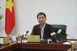 Bộ trưởng Bộ Công Thương Trần Tuấn Anh đang trao đổi với báo chí. (Ảnh: Vietnam+)
