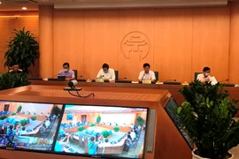 Lãnh đạo Hà Nội họp trực tuyến Ban chỉ đạo COVID-19 thành phố chiều 31/8. (Ảnh: Xuân Quảng/Vietnam+)