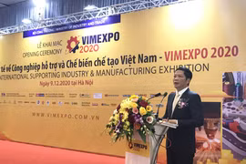 Bộ trưởng Bộ Công Thương Trần Tuấn Anh phát biểu tại Triển lãm quốc tế về công nghiệp hỗ trợ và chế biến, chế tạo sáng 9/12. (Ảnh: Đức Duy/Vietnam+)
