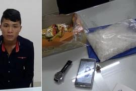 Đối tượng Lò Văn Bốn và tang vật bị thu giữ. (Nguồn: TTXVN)