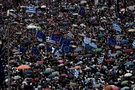 Người dân Hy Lạp tuần hành tại Athens. (Nguồn: AFP/TTXVN)