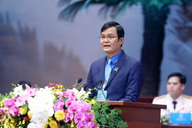 Anh Bùi Quang Huy, Ủy viên dự khuyết Ban chấp hành Trung ương Đảng, Bí thư Thứ nhất Trung ương Đoàn trình bày báo cáo tại đại hội. (Ảnh: Phạm Kiên/TTXVN) 