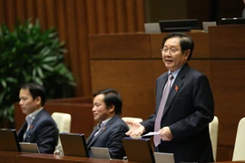 Bộ trưởng Bộ Nội vụ Lê Vĩnh Tân trả lời chất vấn các câu hỏi của đại biểu Quốc hội. (Ảnh: Dương Giang/TTXVN)