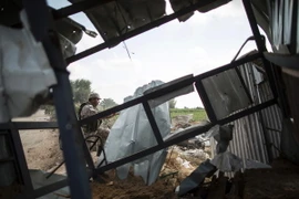 Nhà cửa bị phá hủy sau vụ không kích của Israel tại khu vực Beit Lahia ở phía bắc dải Gaza ngày 22/8. (Nguồn: AFP/TTXVN) 