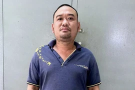 Đối tượng Phạm Hoàng Lợi tại cơ quan Công an. (Ảnh: Trọng Nguyễn/TTXVN phát)