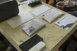 Tang vật vụ phóng viên cưỡng đoạt tài sản hơn 100 triệu đồng tại Điện Biên. (Ảnh: Công an cung cấp)