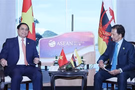 Thủ tướng Phạm Minh Chính gặp Quốc vương Brunei Hassanal Bolkiah. (Ảnh: Dương Giang/TTXVN)