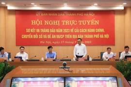 Chủ tịch UBND thành phố Hà Nội Trần Sĩ Thanh, Trưởng Ban Chỉ đạo Cải cách hành chính, chuyển đổi số thành phố Hà Nội chủ trì hội nghị. (Ảnh: Lâm Khánh/TTXVN)