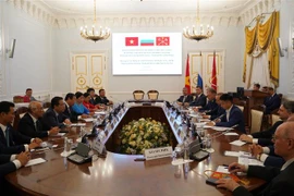 Lễ ký thỏa thuận hợp tác giữa huyện Cần Giờ và quận Kronstadt của St. Petersburg. (Ảnh: Duy Trinh/TTXVN)