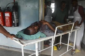 Nạn nhân bị thương trong vụ tấn công tại trường học ở Lhubiriha, tỉnh Mpondwe, Uganda, ngày 17/6/2023. (Ảnh: AFP/TTXVN)