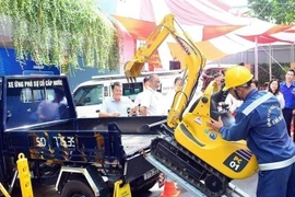 Giới thiệu mô hình sáng tạo, ứng dụng công nghệ trong quản lý hệ thống cấp nước TP. Hồ Chí Minh. (Ảnh: Anh Tuấn/TTXVN)