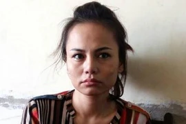 Đối tượng Trần Thị Kim Thu tại cơ quan điều tra. (Ảnh: Mạnh Tú/TTXVN)