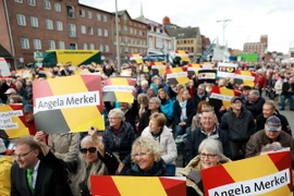 Những người ủng hộ Thủ tướng Angela Merkel tại cuộc vận động tranh cử của đương kim Thủ tướng ở Kappeln, miền Bắc Đức. (Nguồn: AFP/TTXVN)