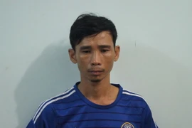 Đối tượng Trần Hữu Việt tại Cơ quan công an Bình Dương. (Ảnh: Nguyễn Văn Việt/TTXVN)