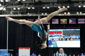 Vận động viên Phan Thị Hà Thanh (Việt Nam) thi đấu nội dung cầu thăng bằng. (Ảnh: Quốc Khánh/TTXVN)