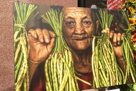 Chân dung người phụ nữ H'Mông ở Quản Bạ, Hà Giang qua ống kính của nhiếp ảnh gia Réhahn. (Ảnh: Mai Mai/Vietnam+)