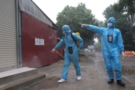 [Photo] Hà Nội xét nghiệm tiếp xúc gần với ca nghi mắc COVID-19 mới