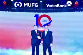 Chủ tịch HĐQT VietinBank và Giám đốc MUFG Bank tại buổi lễ. (Ảnh: Vietnam+)