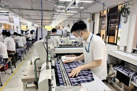 Hoạt động sản xuất - kinh doanh của doanh nghiệp tiếp tục gặp nhiều khó khăn trước các tác động tiêu cực từ bên ngoài. (Ảnh: PV/Vietnam+)