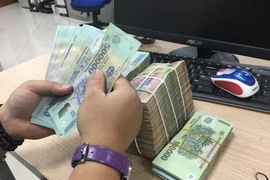 Ngân hàng Nhà nước bơm trả toàn bộ tiền hút qua tín phiếu. (Ảnh: PV/Vietnam+)
