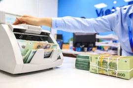 Ngân hàng Nhà nước khẳng định Thông tư 06 tháo gỡ rất nhiều nội dung nhằm tạo điều kiện thuận lợi cho khách hàng. (Ảnh: PV/Vietnam+)