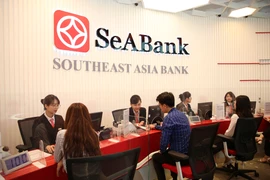 Giao dịch tại SeABank. (Ảnh: Vietnam+)
