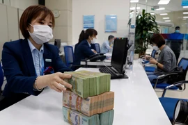 Lãi suất liên ngân hàng tăng mạnh. (Ảnh: PV/Vietnam+)