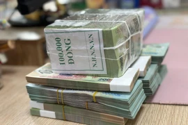 Lãi suất liên ngân hàng tăng mạnh nhất trong 4 tháng qua. (Ảnh: PV/Vietnam+)