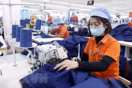 Sản xuất hàng dệt may. (Nguồn: TTXVN)