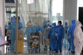 Đoàn về Lâm Đồng trong chuyến bay đầu tiên sáng 4/9 gồm thai phụ có hộ khẩu ở các huyện Cát Tiên, Lâm Hà và Đức Trọng. (Ảnh: Nguyễn Dũng/TTXVN)