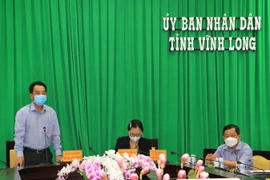 Chủ tịch UBND tỉnh Vĩnh Long Lữ Quang Ngời phát biểu tại cuộc họp Ban chỉ đạo phòng, chống dịch COVID-19 tỉnh ngày 22/6. (Ảnh: Lê Thúy Hằng/TTXVN)