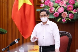 Thủ tướng Phạm Minh Chính yêu cầu thực hiện nghiêm túc các biện pháp phòng, chống dịch trong các khu công nghiệp. (Ảnh: Dương Giang/TTXVN)