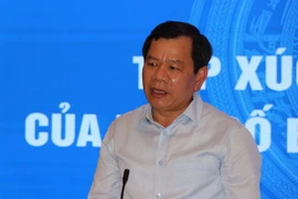 Chủ tịch UBND tỉnh Đặng Văn Minh phát biểu tại buổi đối thoại. (Ảnh: Sỹ Thắng/TTXVN)