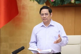 Thủ tướng Phạm Minh Chính nhấn mạnh phương châm lấy xã, phường, thị trấn, nhà máy, xí nghiệp làm “pháo đài,” mỗi người dân là “chiến sỹ” phòng chống dịch COVID-19. (Ảnh: Dương Giang/TTXVN)