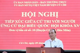 Chủ tịch nước Nguyễn Xuân Phúc trình bày chương trình hành động tại buổi tiếp xúc cử tri huyện Củ Chi. (Ảnh: Thống Nhất/TTXVN)