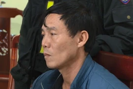 Đối tượng Trần Hoài Nam bị lực lượng công an bắt giữ. (Ảnh: Trịnh Duy Hưng/TTXVN)