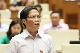 Bộ trưởng Bộ Công Thương Trần Tuấn Anh phát biểu giải trình, làm rõ vấn đề đại biểu Quốc hội nêu. (Ảnh: Văn Điệp/TTXVN)