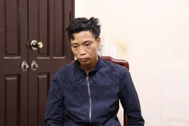 Đối tượng Lò Văn Mính tại cơ quan điều tra. (Ảnh: Đinh Văn Nhiều/TTXVN)