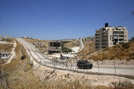 Những tòa nhà của người Palestine tại thành phố Sur Baher, miền Đông Jerusalem, ngày 19/7. (Ảnh: AFP/TTXVN)