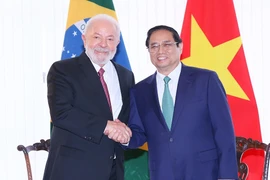 Thủ tướng Phạm Minh Chính với Tổng thống Brazil Lula da Silva. (Ảnh: Dương Giang/TTXVN)