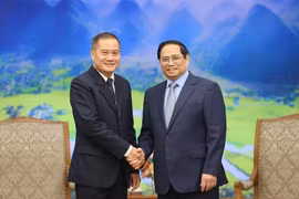 Thủ tướng Phạm Minh Chính tiếp Tổng Giám đốc Thông tấn xã Pathet Lào (KPL) Khampheuy Philapha. (Ảnh: Dương Giang/TTXVN)