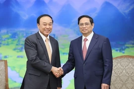 Thủ tướng Phạm Minh Chính tiếp Bộ trưởng Bộ Y tế Lào Bounfeng Phoummalaysith. (Ảnh: Dương Giang/TTXVN)