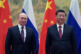 Chủ tịch Trung Quốc Tập Cận Bình (phải) và Tổng thống Nga Vladimir Putin tại một cuộc gặp. (Ảnh: AFP/TTXVN)
